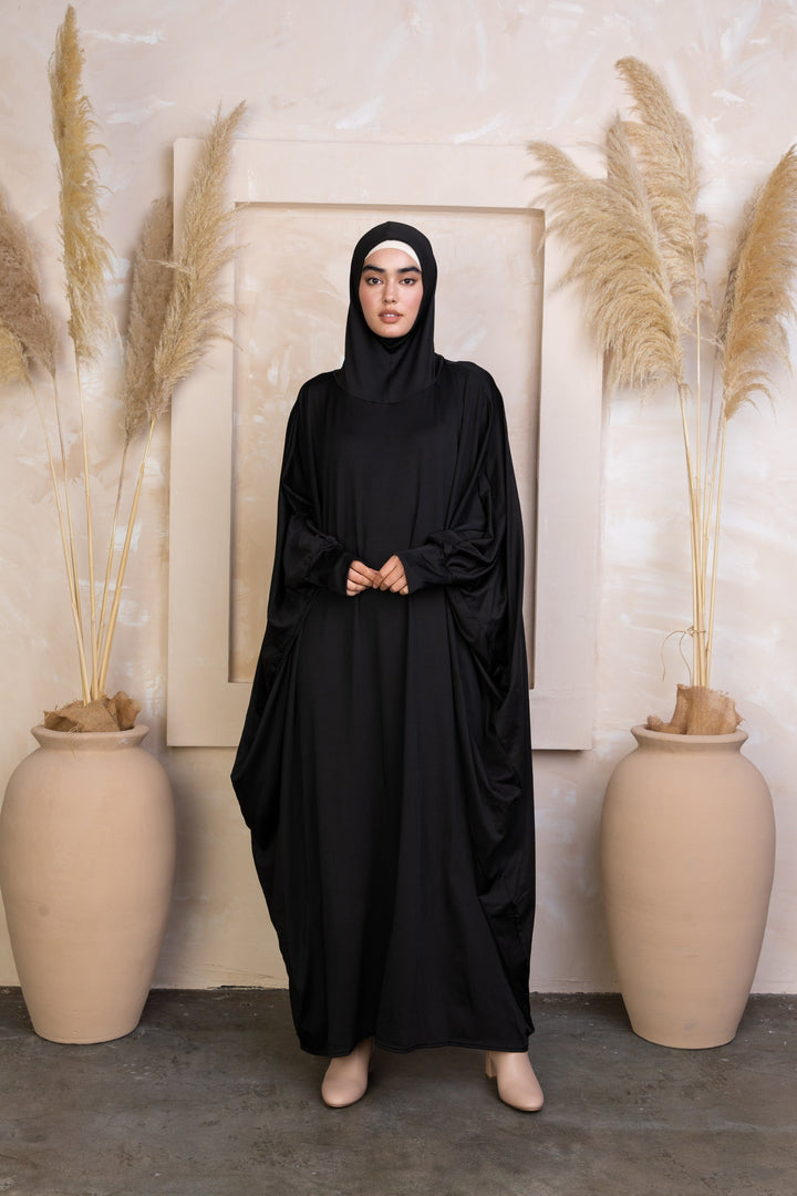 Black loose-fitting abaya with attached hijab, perfect for Salah outfit in breathable material