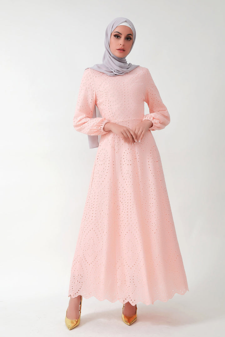 Woman wearing a Peach Eyelet Long Sleeve Maxi Dress with gray hijab