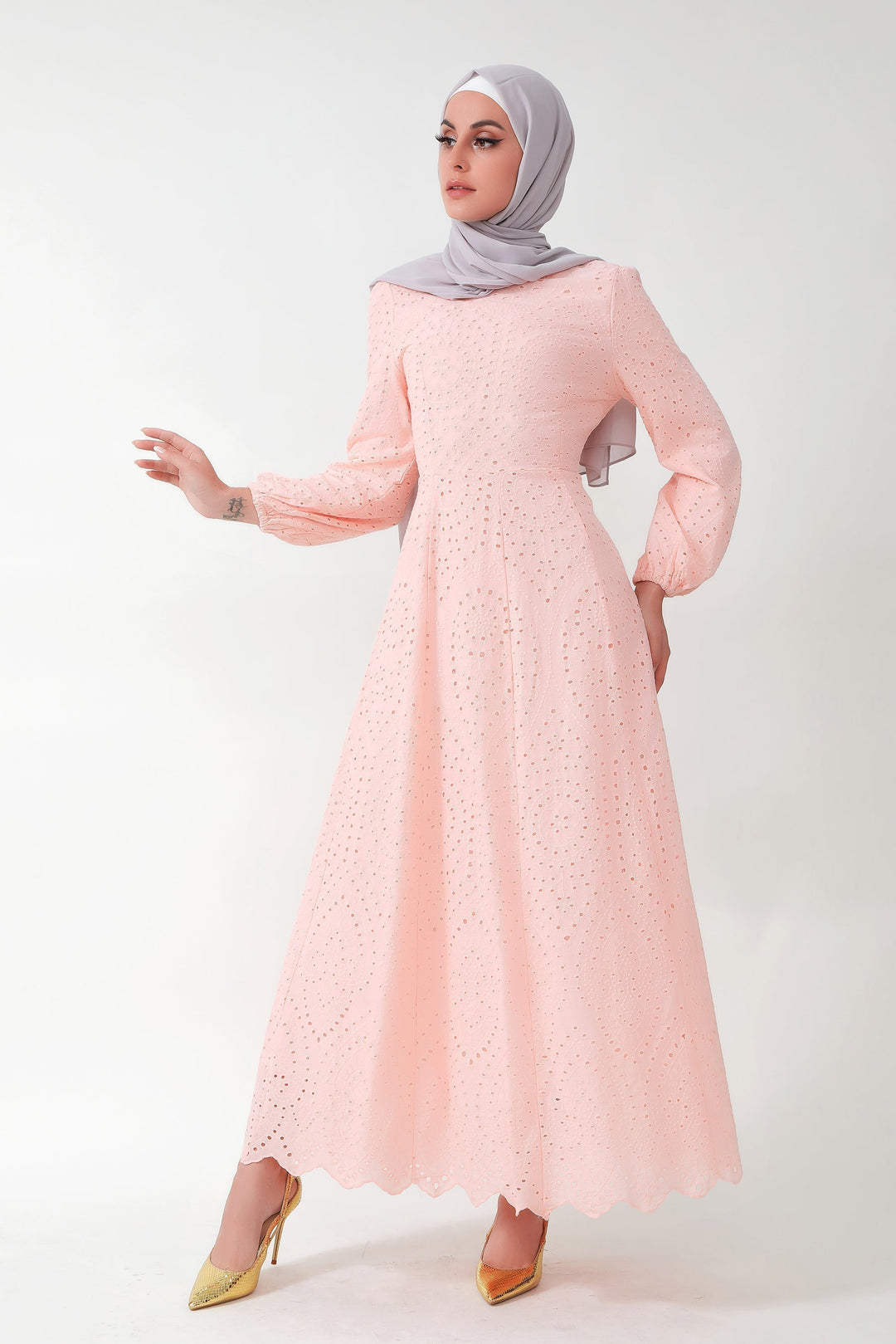 Light pink eyelet long sleeve maxi dress paired with a gray hijab for a stylish look