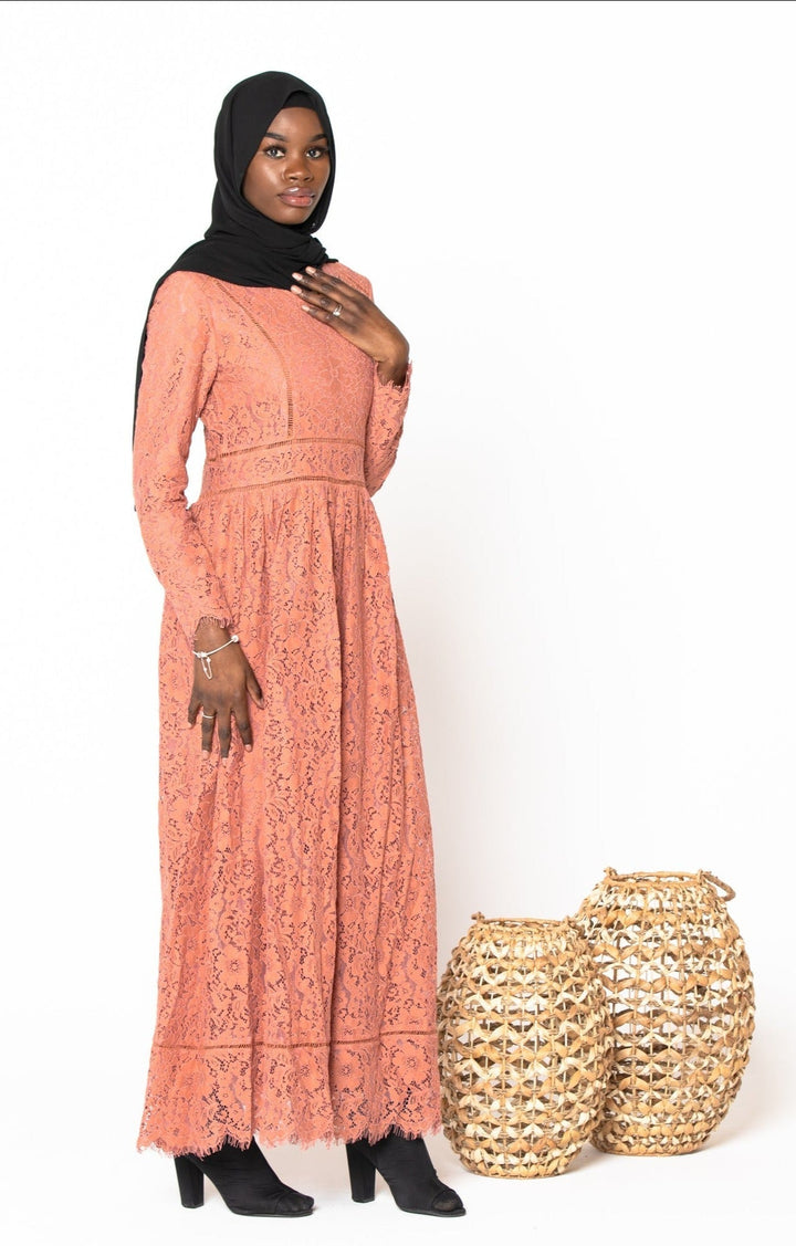 Woman in Peach Zahra Lace Long Sleeve Maxi Gown with black hijab and zipper closure