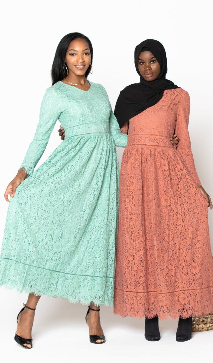 Two women wearing Peach Zahra Lace Long Sleeve Maxi Gown with zipper closure and guipure lace