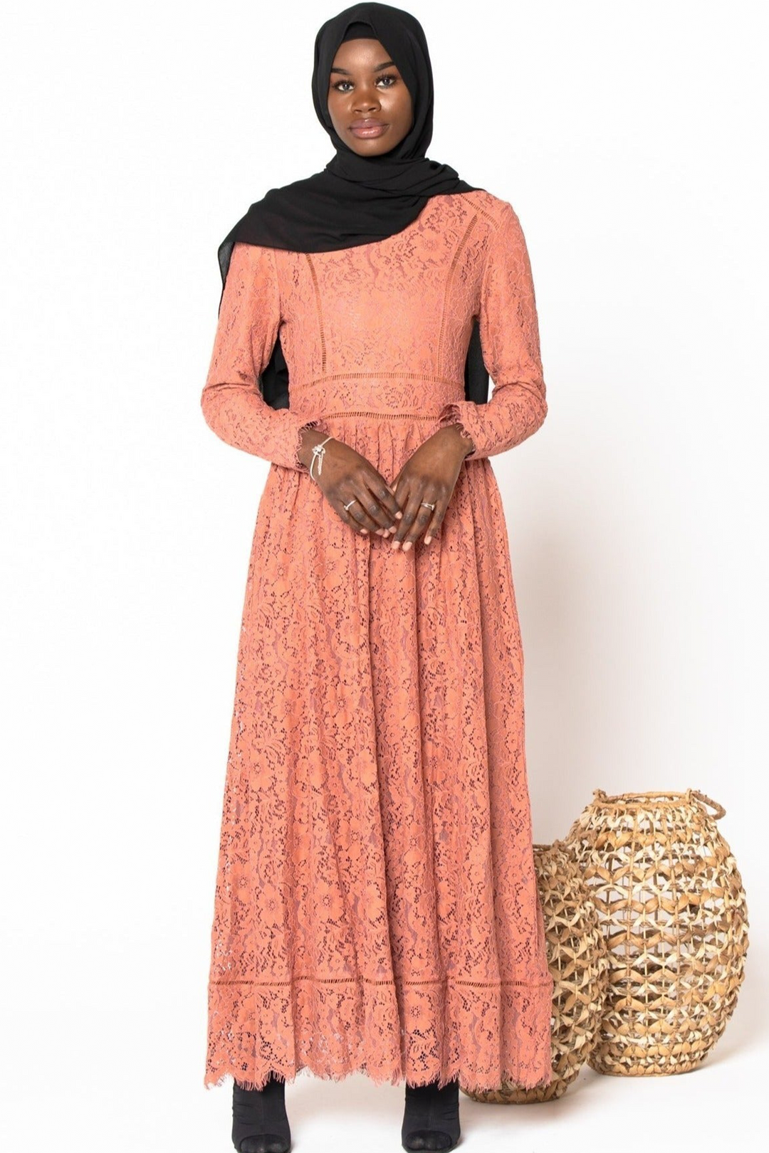 Long-sleeved coral lace dress paired with a black hijab, Peach Zahra Maxi Gown