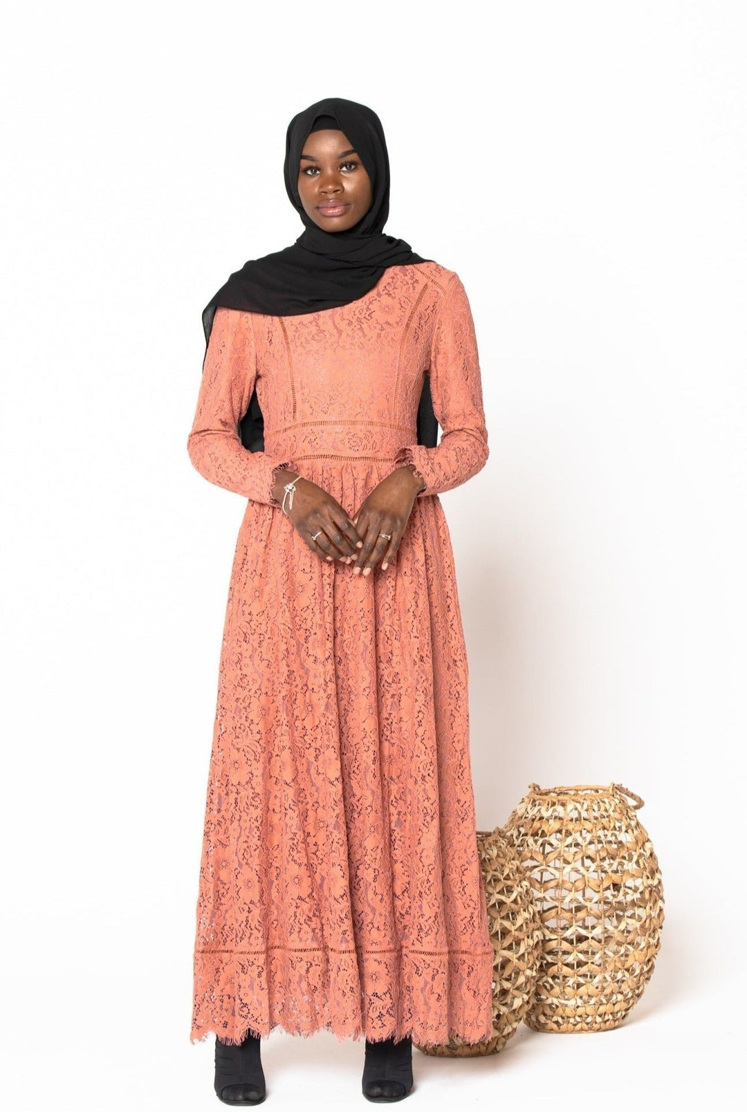 Long-sleeved coral Zahra Lace Maxi Gown with black hijab and zipper closure