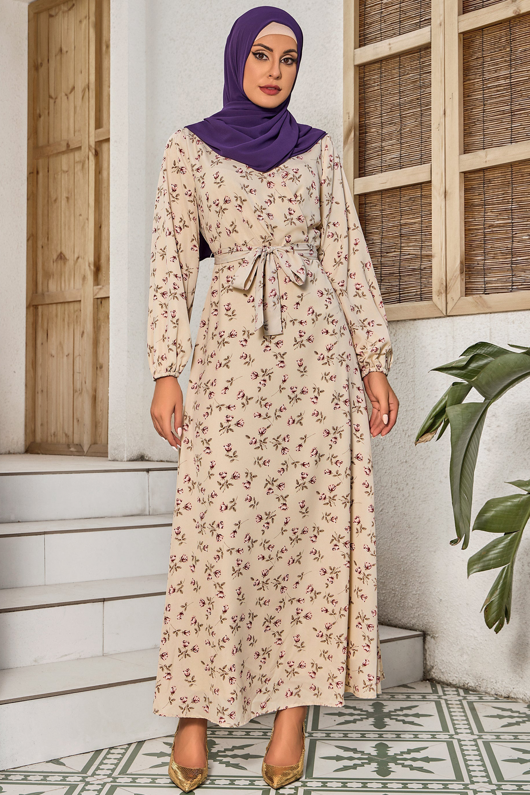 Woman in Petal Perfect Cream Maxi Dress with criss cross neckline and hijab