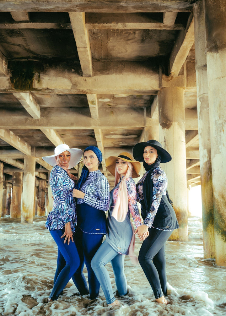 Four women in a Pink and Blue Floral 3 Piece Modest Swimsuit enjoying the beach