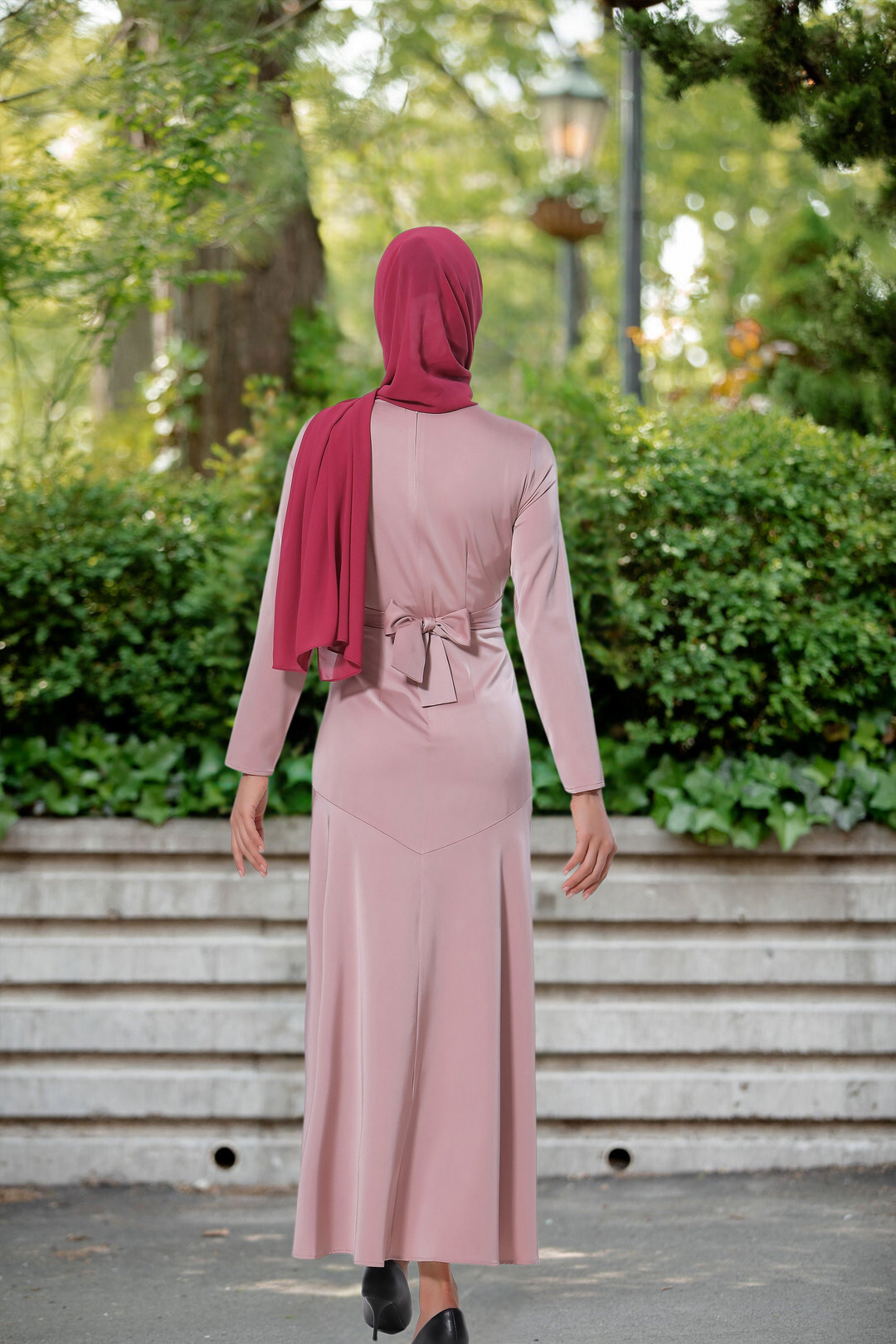 Woman in pink dress and maroon hijab wearing Pink Criss Cross Satin Maxi Dress