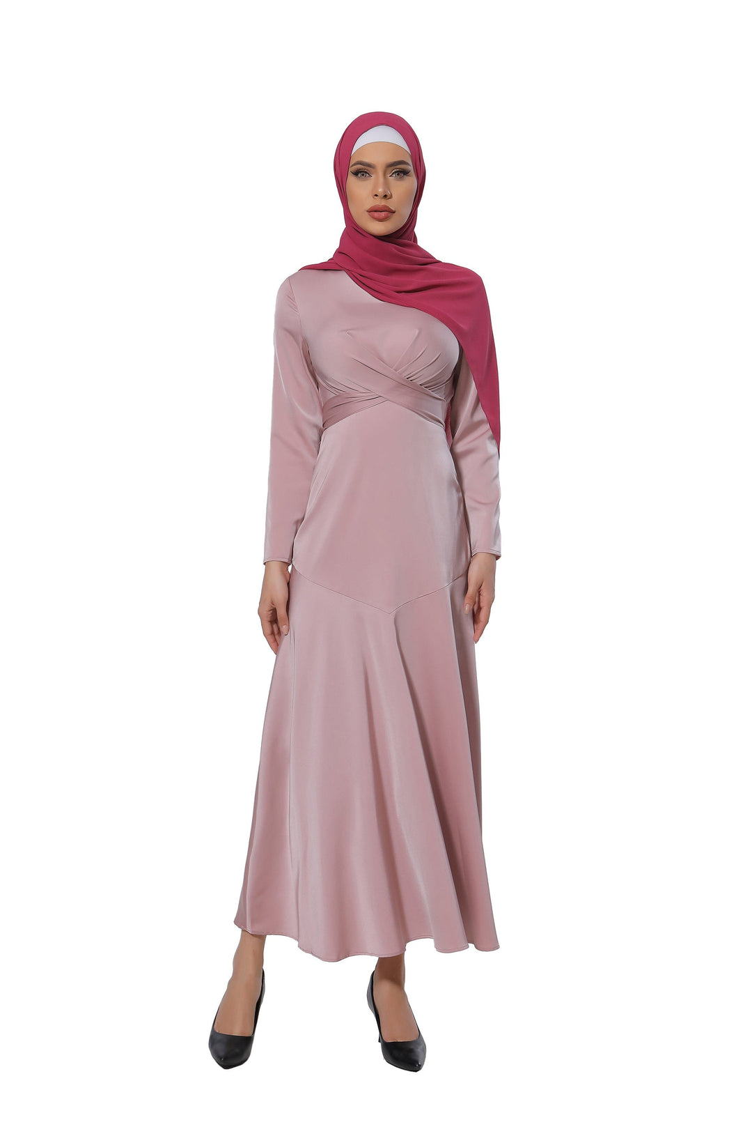 Woman in a pink criss cross satin long sleeve maxi dress with red hijab