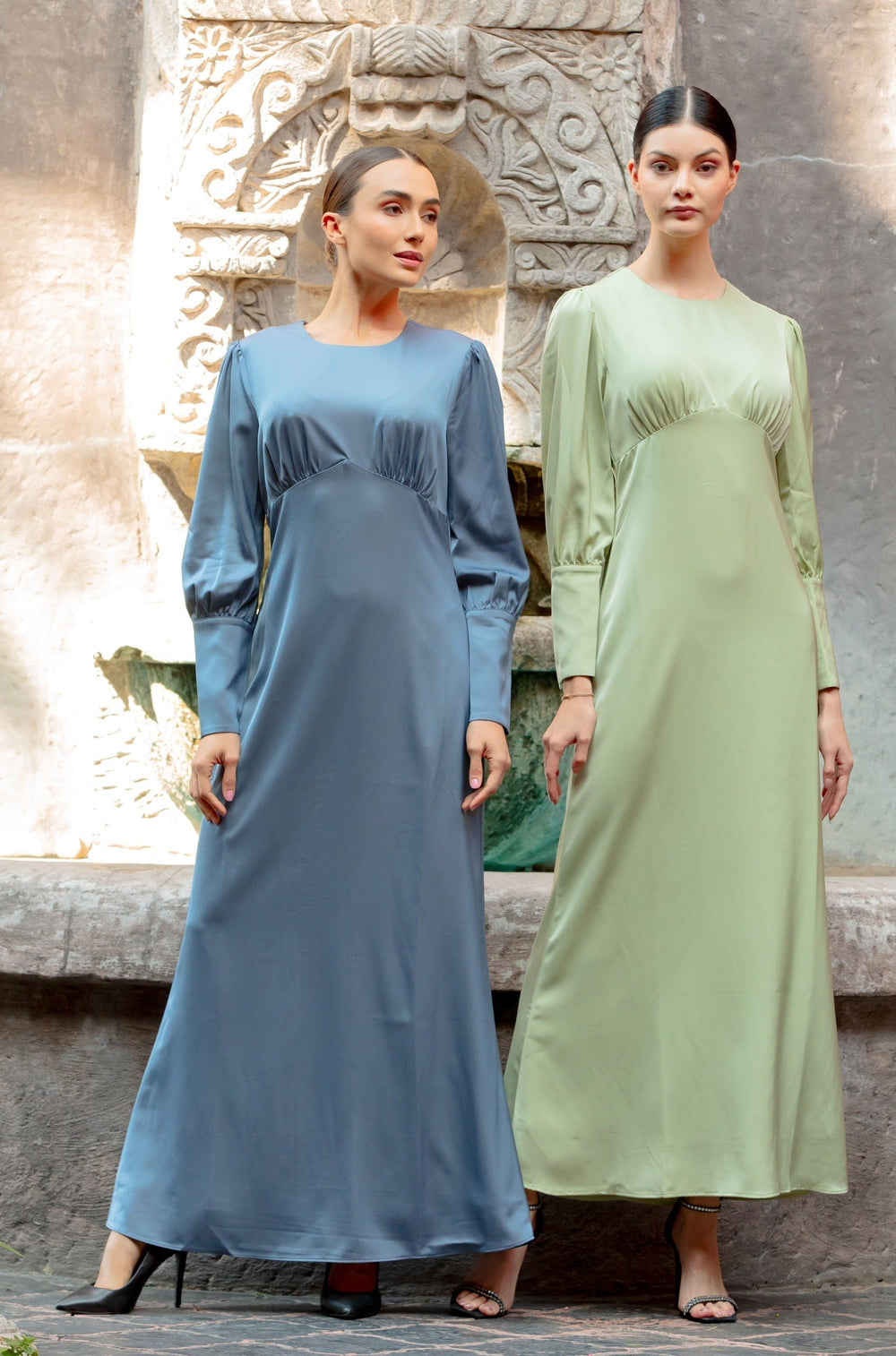 Two women in long satin Pistachio Satin Long Sleeve Maxi Dresses