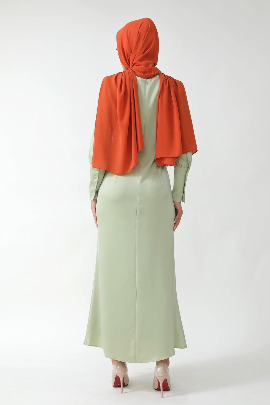 Modest Pistachio Satin Long Sleeve Maxi Dress paired with orange hijab and batwing sleeves