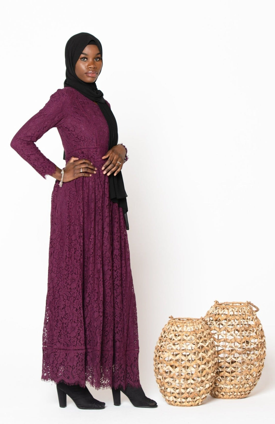 Woman in Plum Zahra Lace Long Sleeve Maxi Gown with black hijab and zipper closure