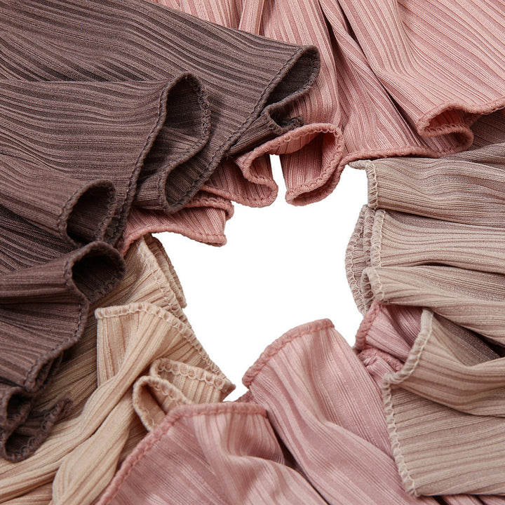 Pleated fabric in muted colors showcasing Ribbed Jersey Hijab with ribbed texture