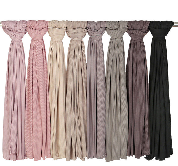 Assorted pleated scarves featuring Ribbed Jersey Hijab in various colors and ribbed texture