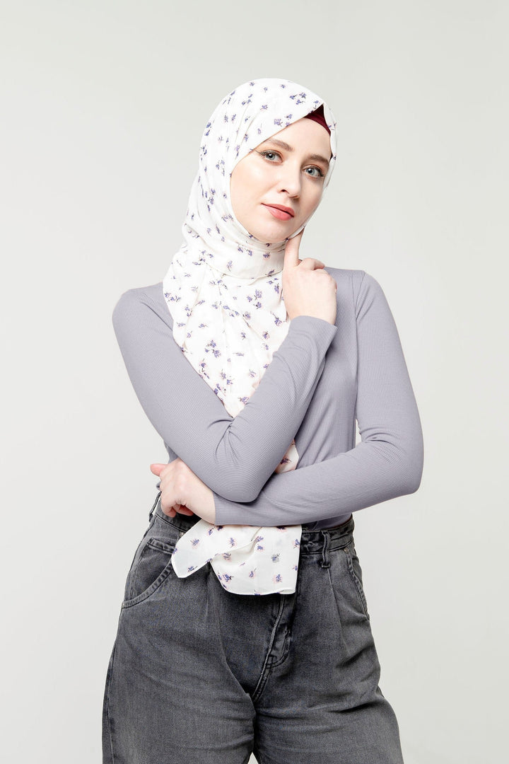 Woman in a floral hijab showcasing a Ribbed Turtleneck Long Sleeve Sweater in premium jersey