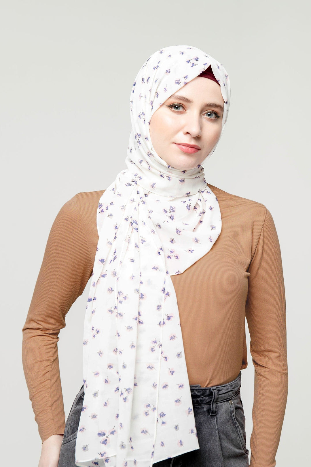 Woman in a floral hijab wearing a Ribbed Turtleneck Long Sleeve Sweater in premium jersey