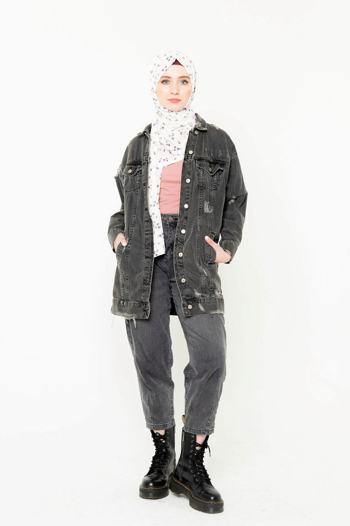 Woman in distressed denim jacket and hijab styled with a long sleeve premium jersey sweater