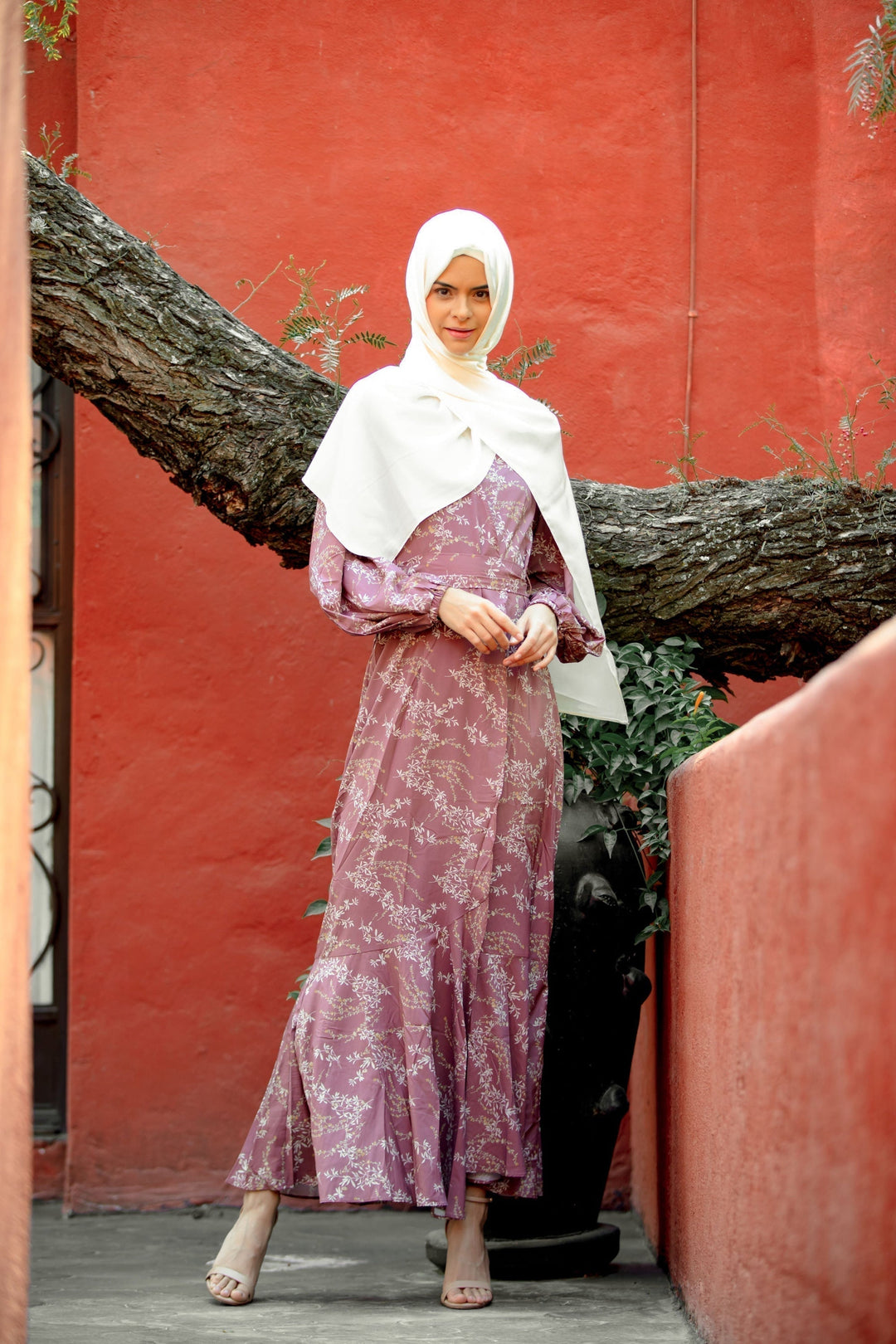 Woman in a floral dress and hijab wearing a Rose Floral Ruffle Faux Wrap Maxi Dress