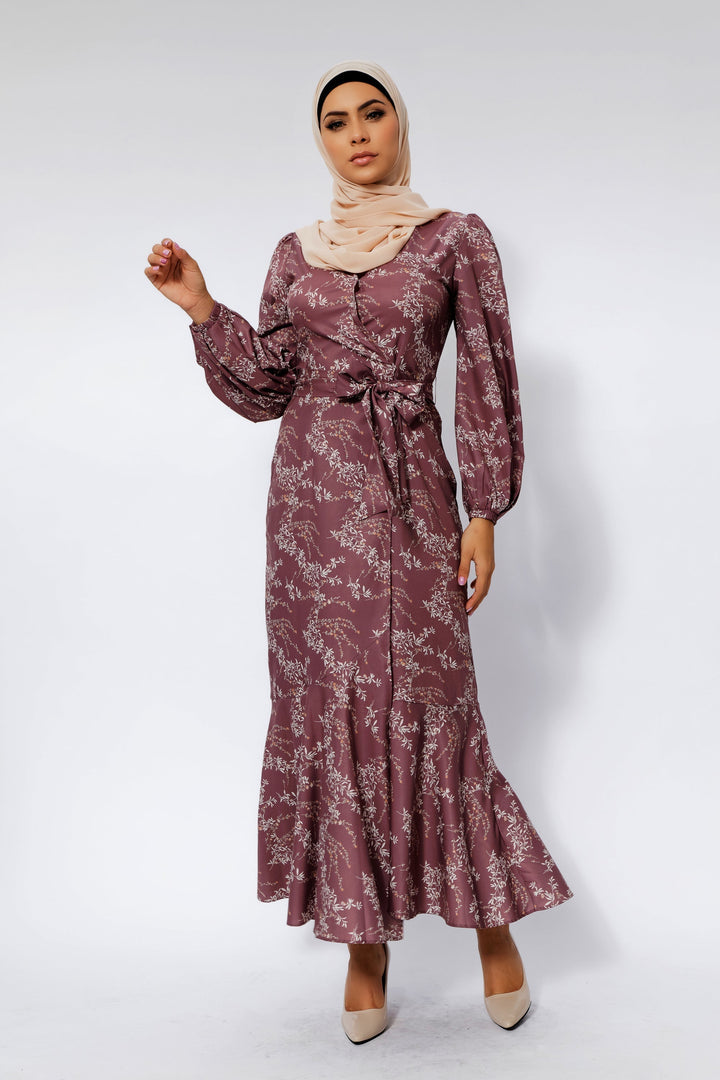 Woman in a floral ruffle faux wrap Rose Floral Ruffle Faux Wrap Maxi Dress on clearance