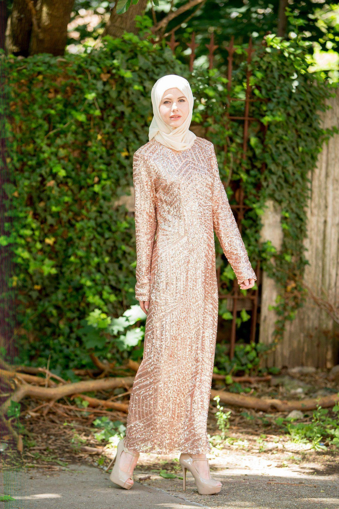 Sequin gown in rose gold with matching hijab and heels, embodying urban modesty