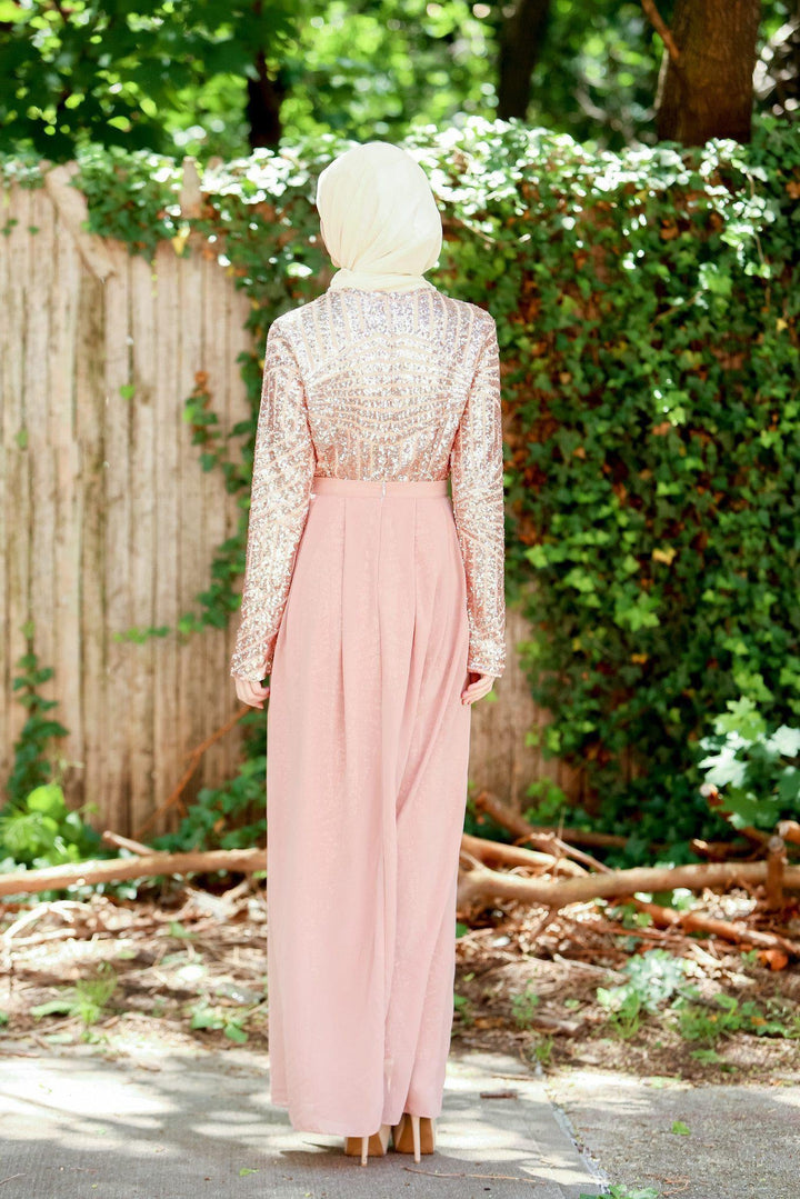 Woman modeling a Rose Gold Chevron Sequin Gown, embracing urban modesty and elegance