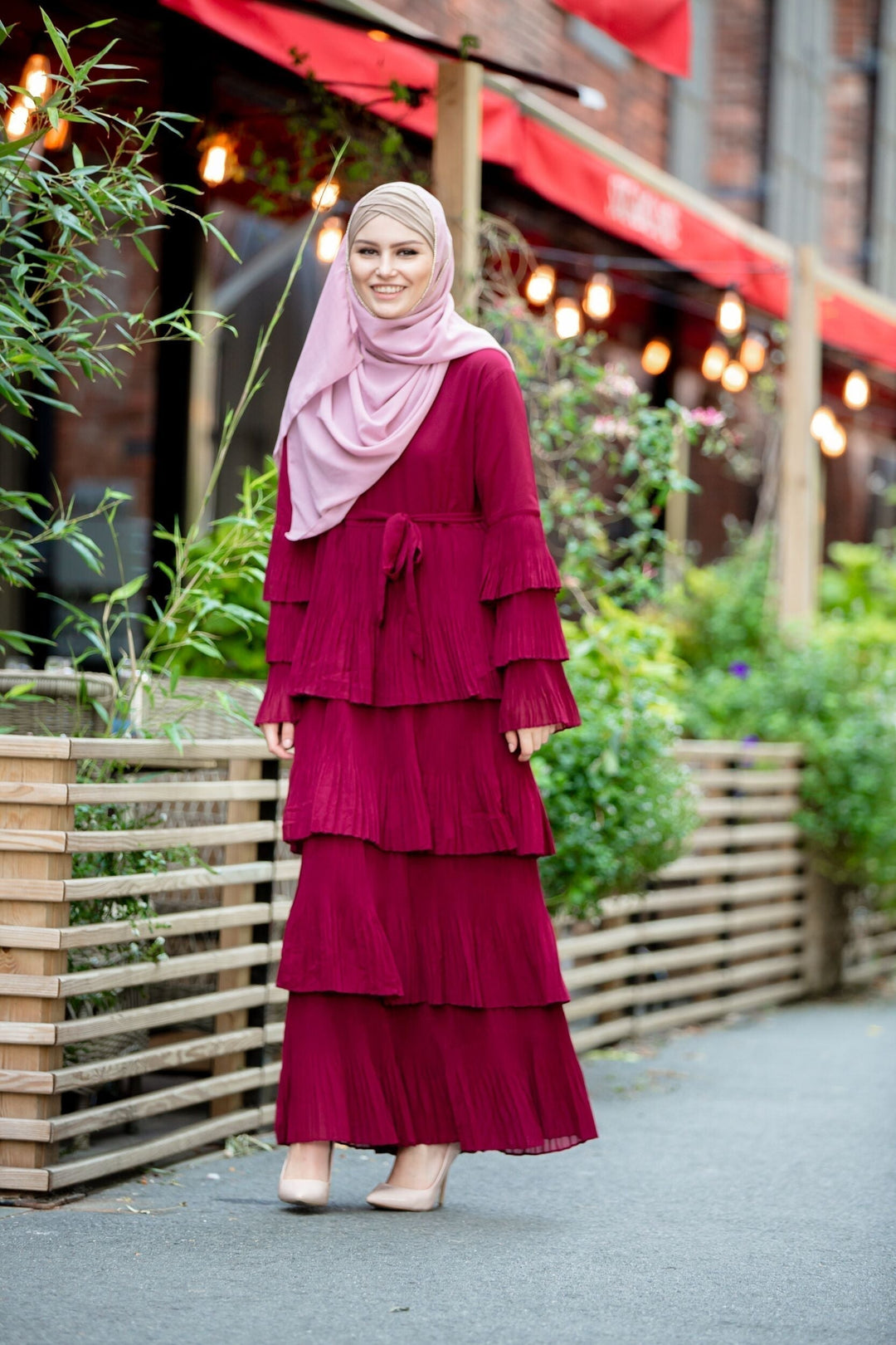 Burgundy tiered dress with hijab featuring pink rhinestone trim chiffon details