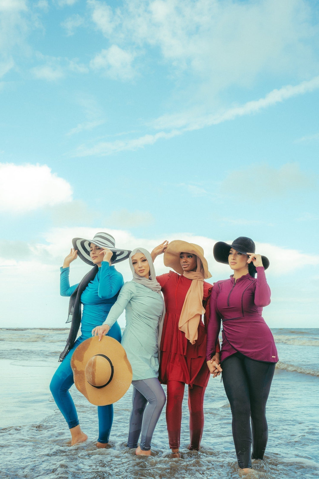 Four women in stylish modest swimwear showcasing the Ruched 3 Piece Swimsuit