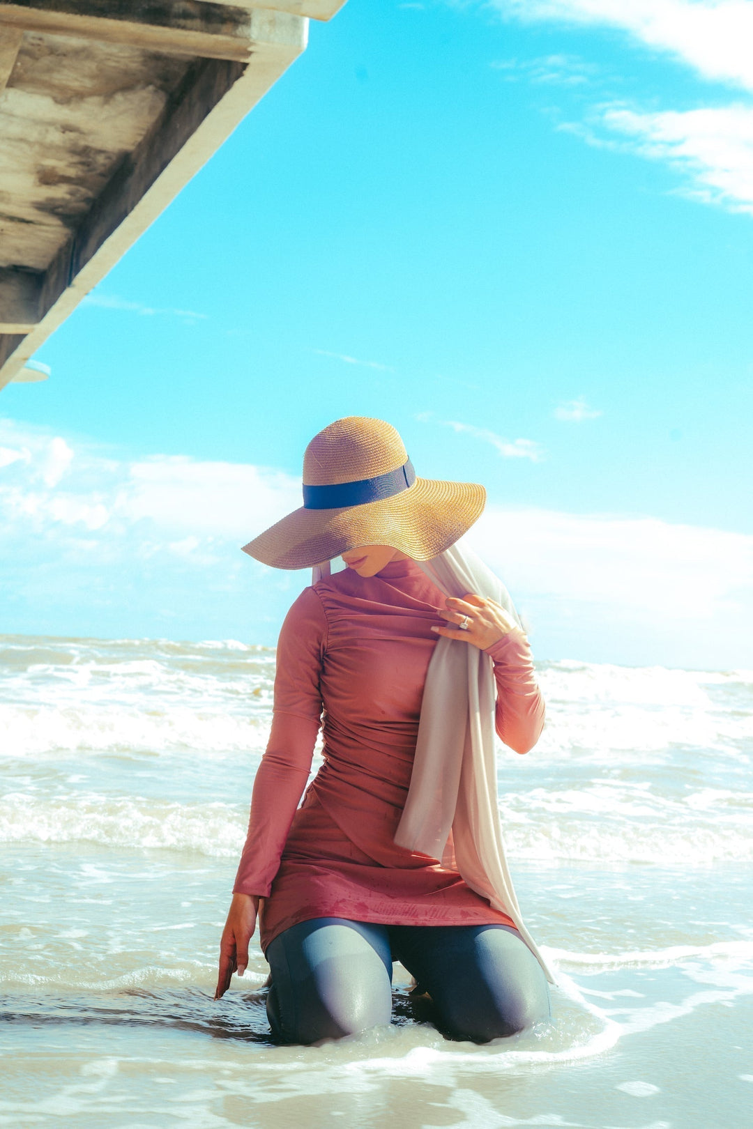 Woman in modest swimsuit and sun hat from Ruched 3 Piece Modest Swimsuit-Clearance