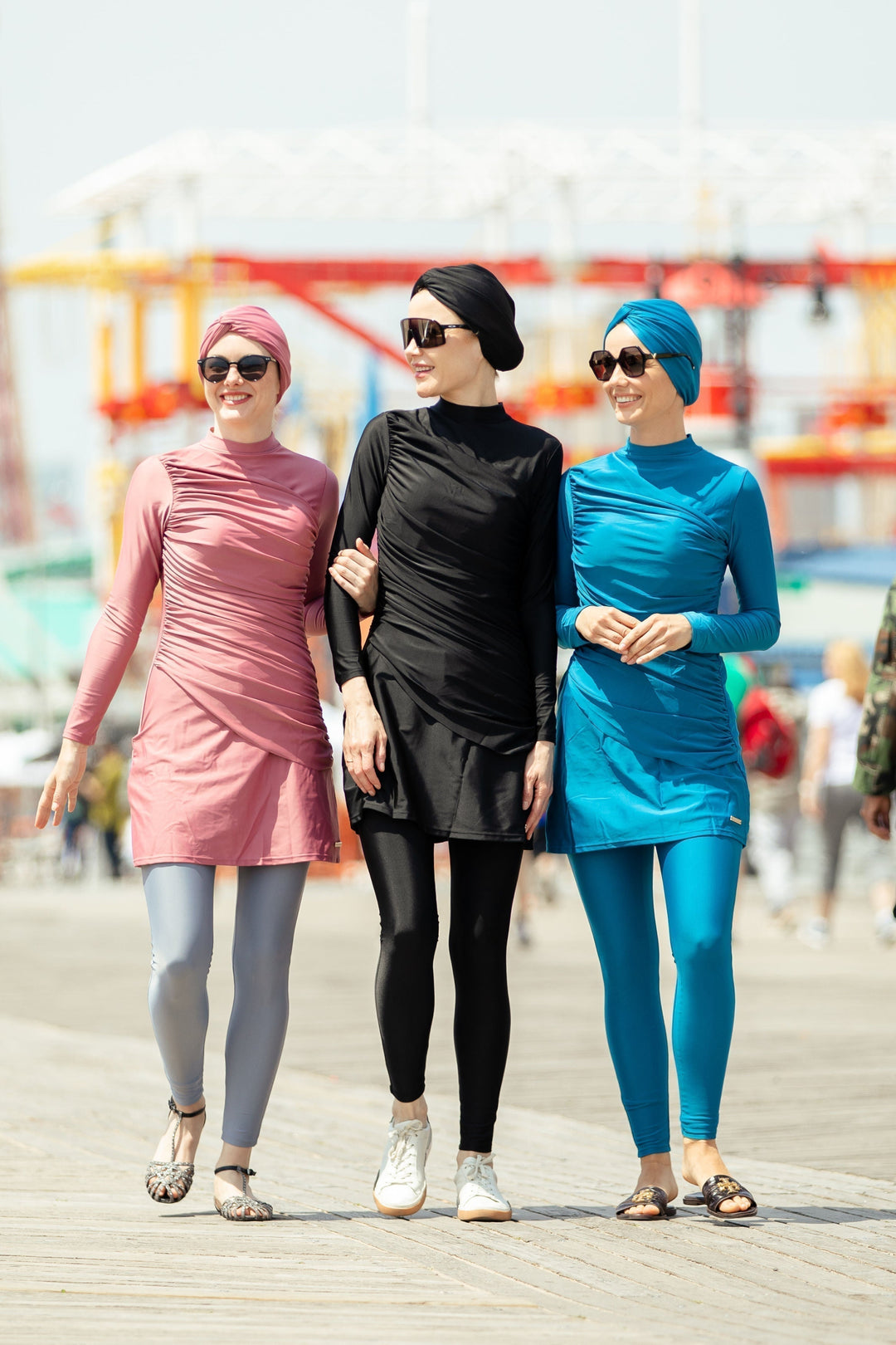 Three women in modest swimwear modeling Ruched 3 Piece Modest Swimsuit clearance offer