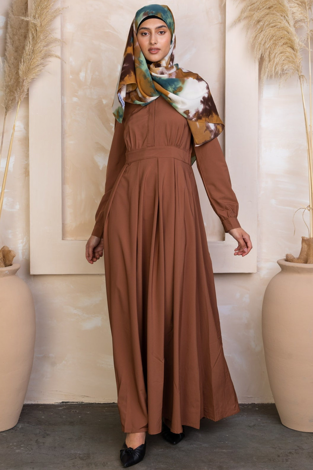 Brown long-sleeved Rusty Brown Lattice Abaya Maxi Dress with colorful hijab displayed