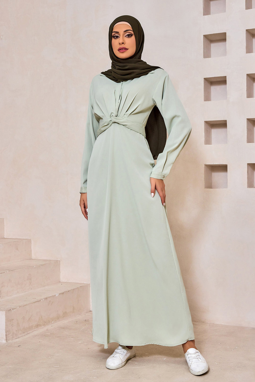 Mint green modest dress with long sleeves featuring a Sage Criss Cross design