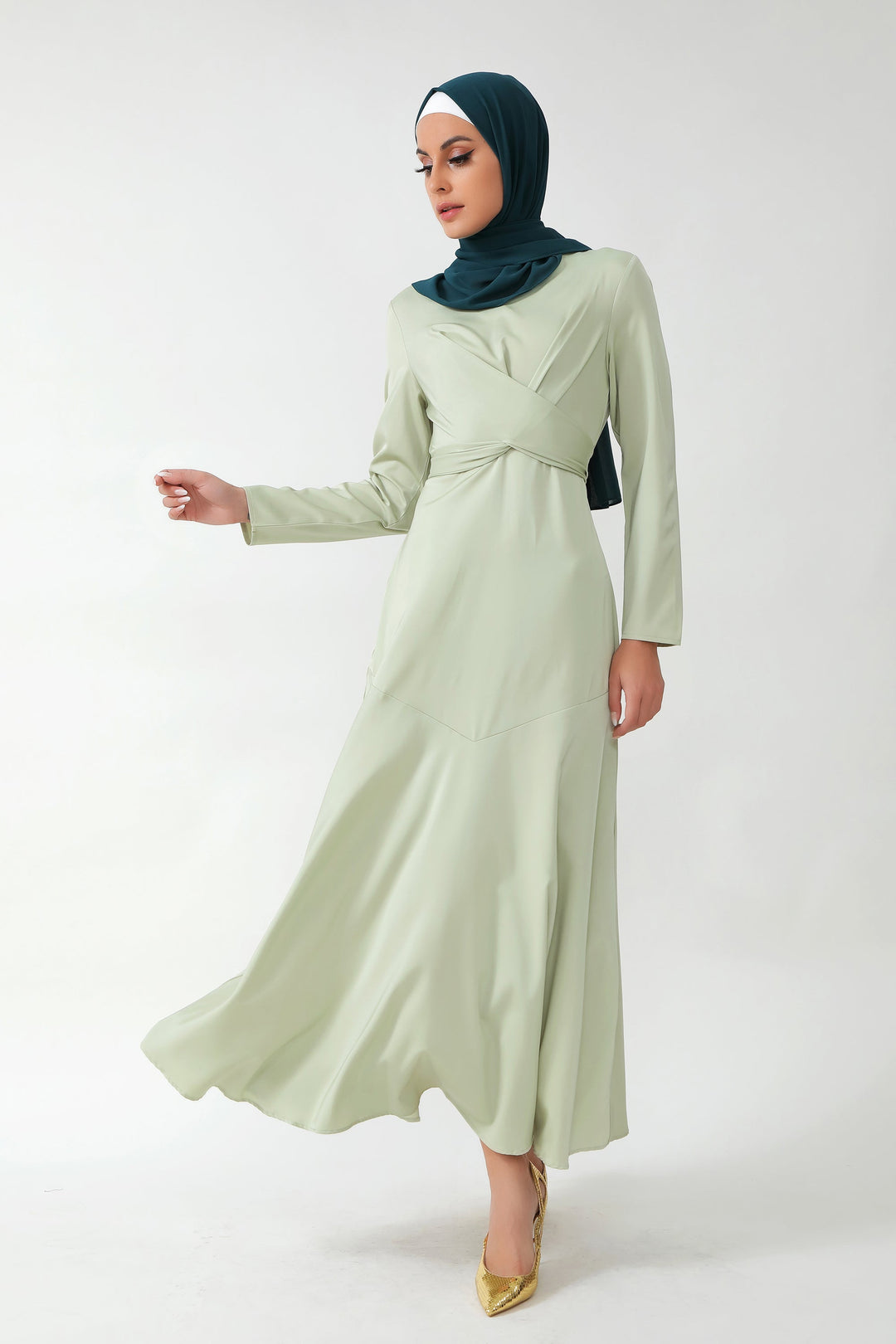 Woman in Sage Green Criss Cross Satin Long Sleeve Maxi Dress with Dark Green Hijab