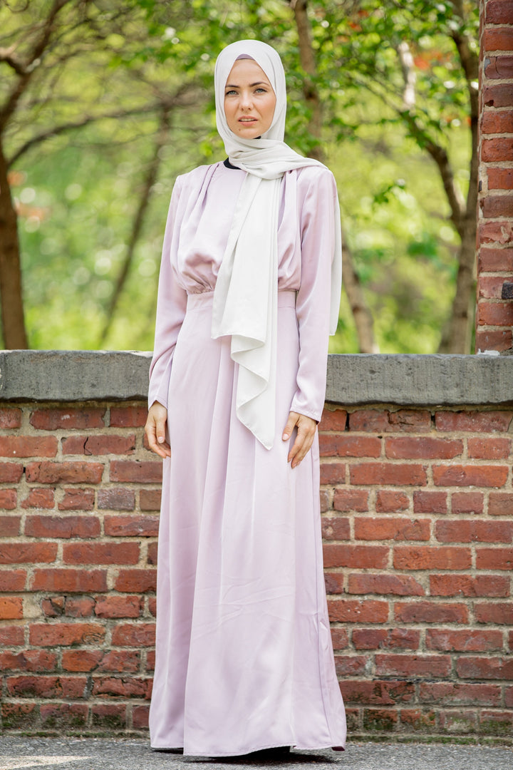 Woman in a light purple Satin Pleated Maxi Dress and white hijab on clearance sale