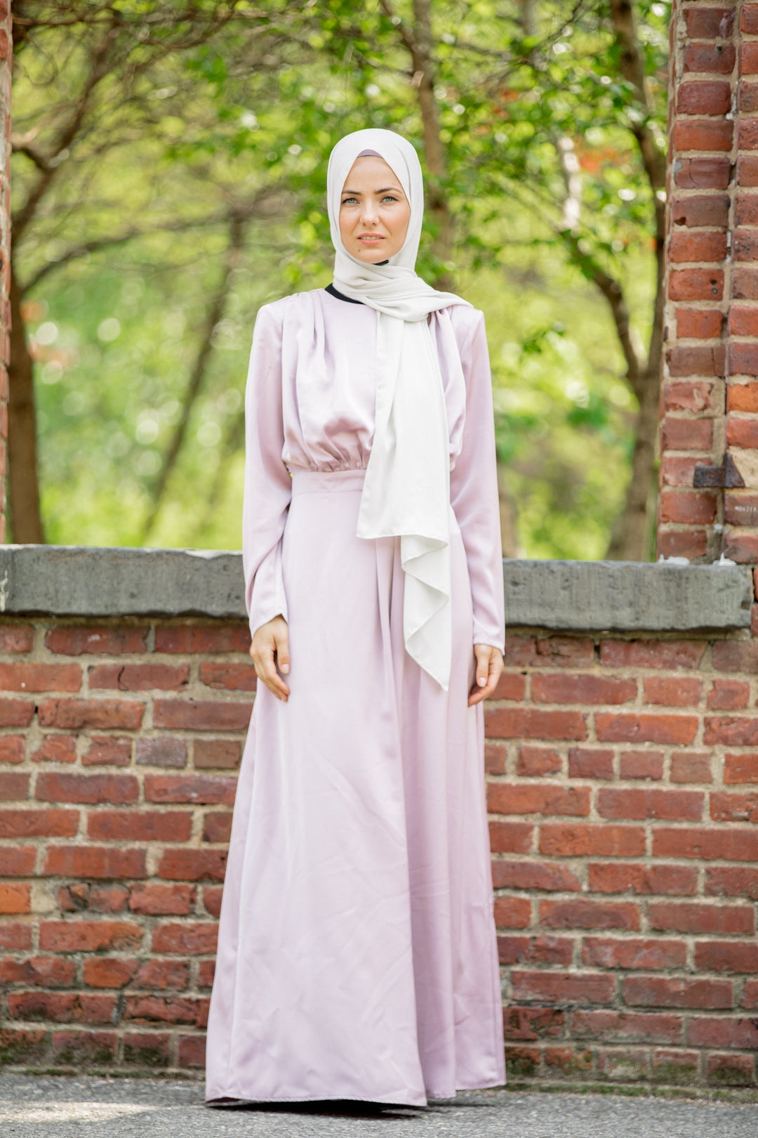 Woman in a Satin Pleated Maxi Dress and Hijab showcasing elegant modest fashion