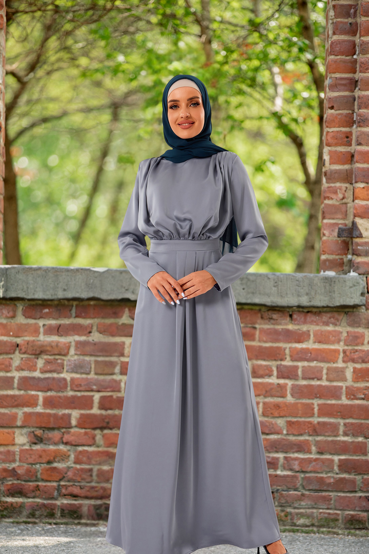 Long-sleeved gray satin pleated maxi dress with matching hijab for modest fashion