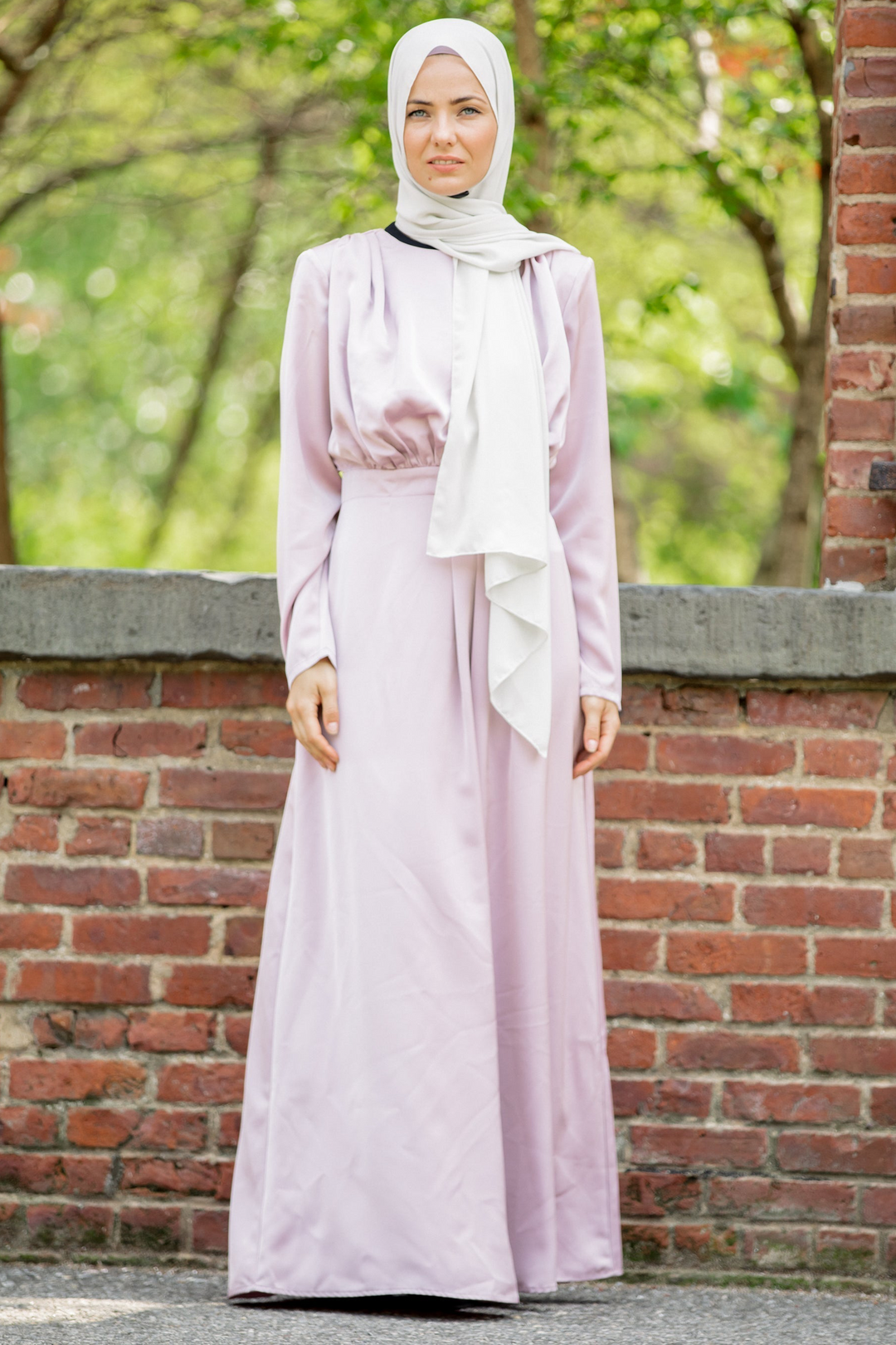 Woman in a light purple Satin Pleated Maxi Dress with a white hijab on CLEARANCE