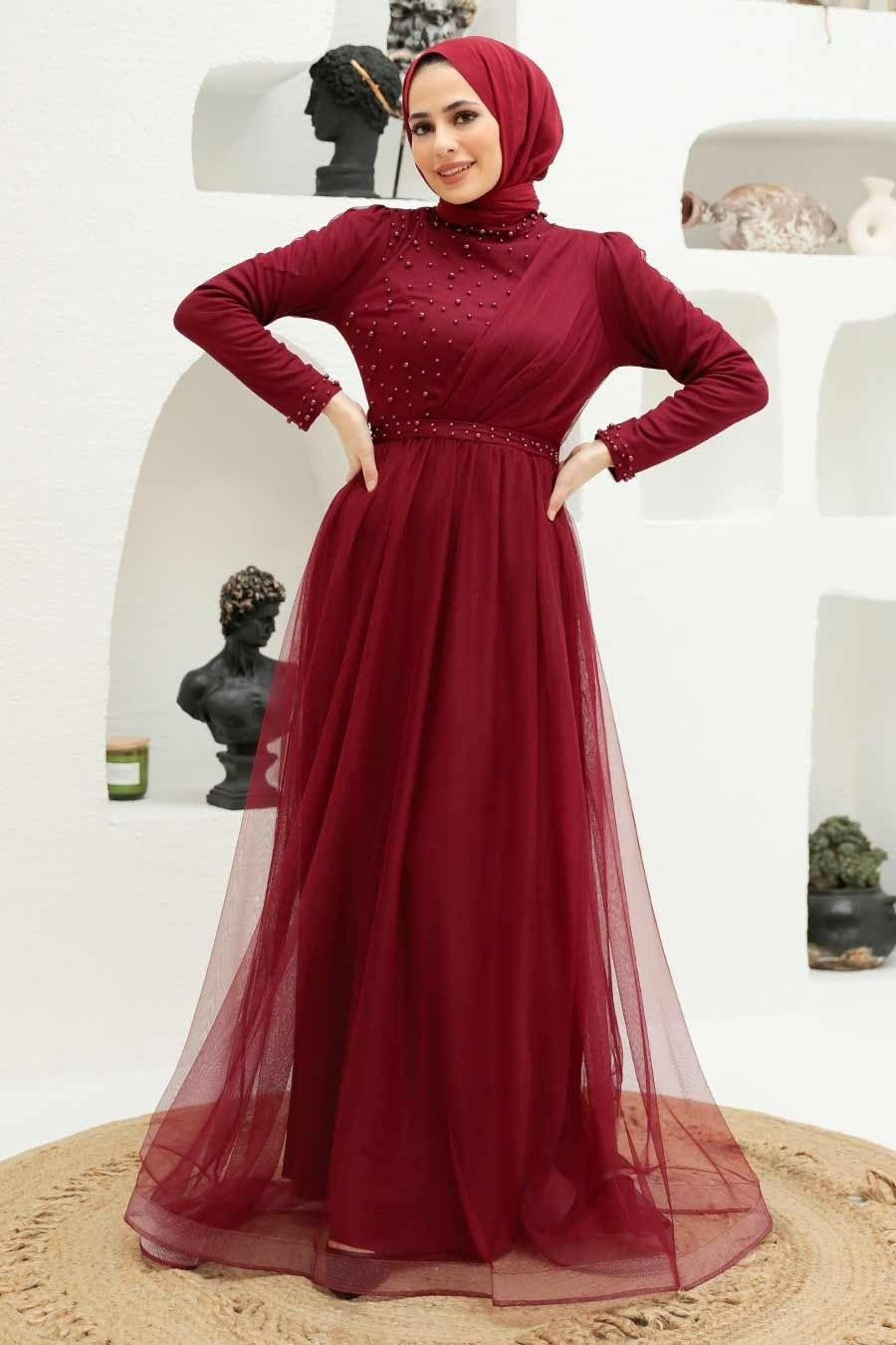 Burgundy beaded long-sleeved Side Pearl Gown perfect for formal occasions and events