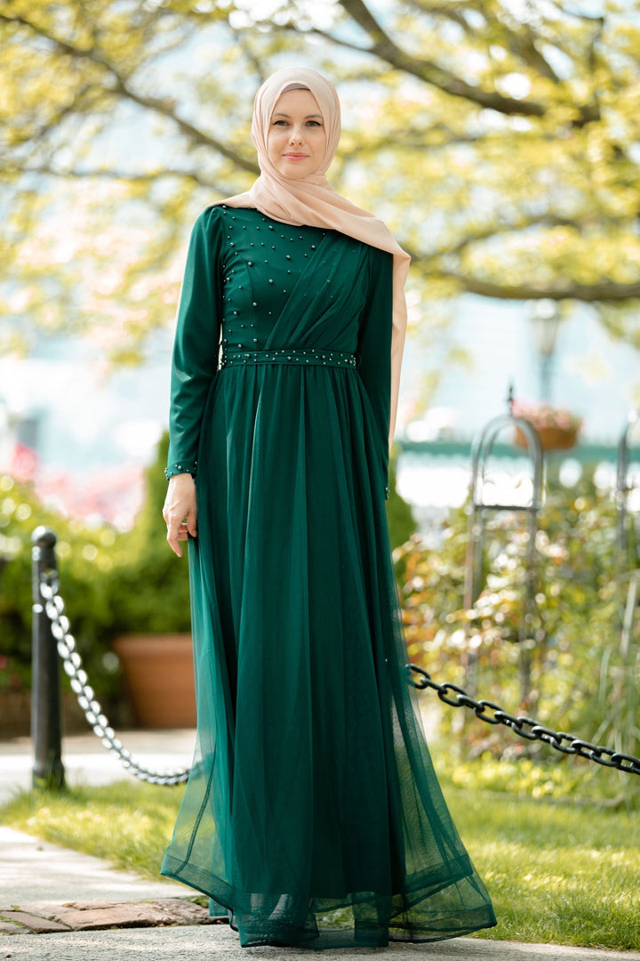 Elegant green modest dress featuring a side pearl detail in a stylish maxi gown