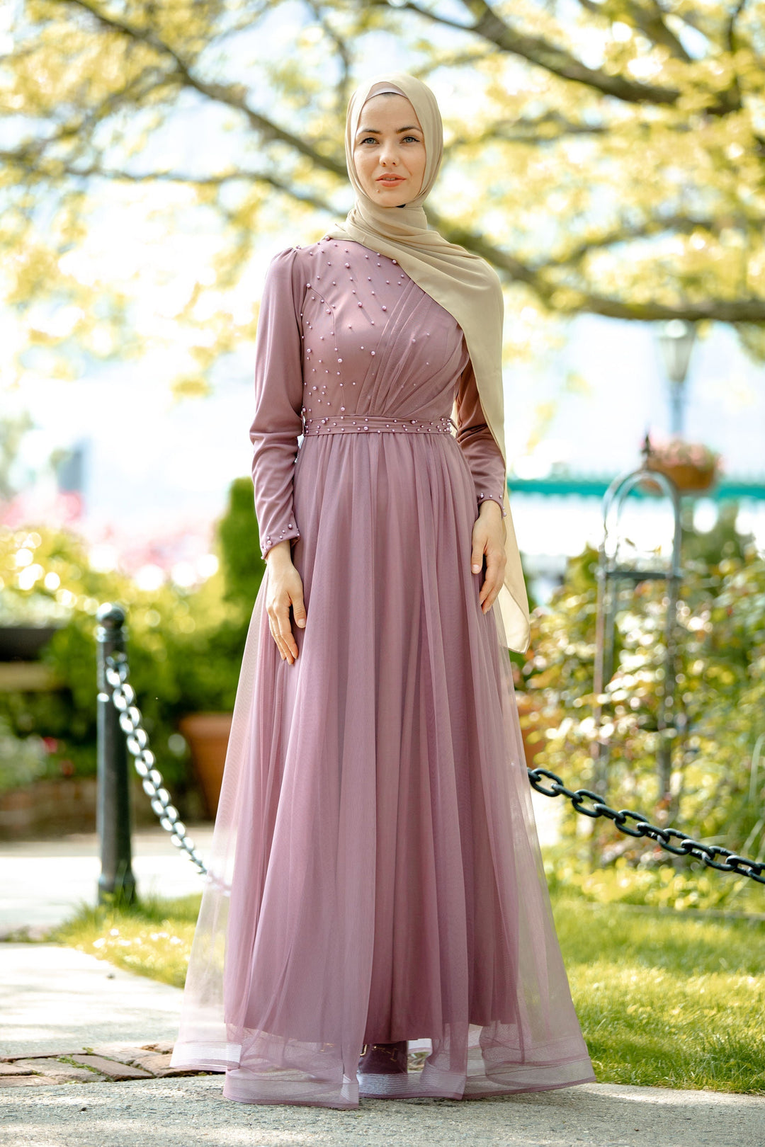 Elegant mauve gown with hijab featuring side pearl details for stylish modest fashion