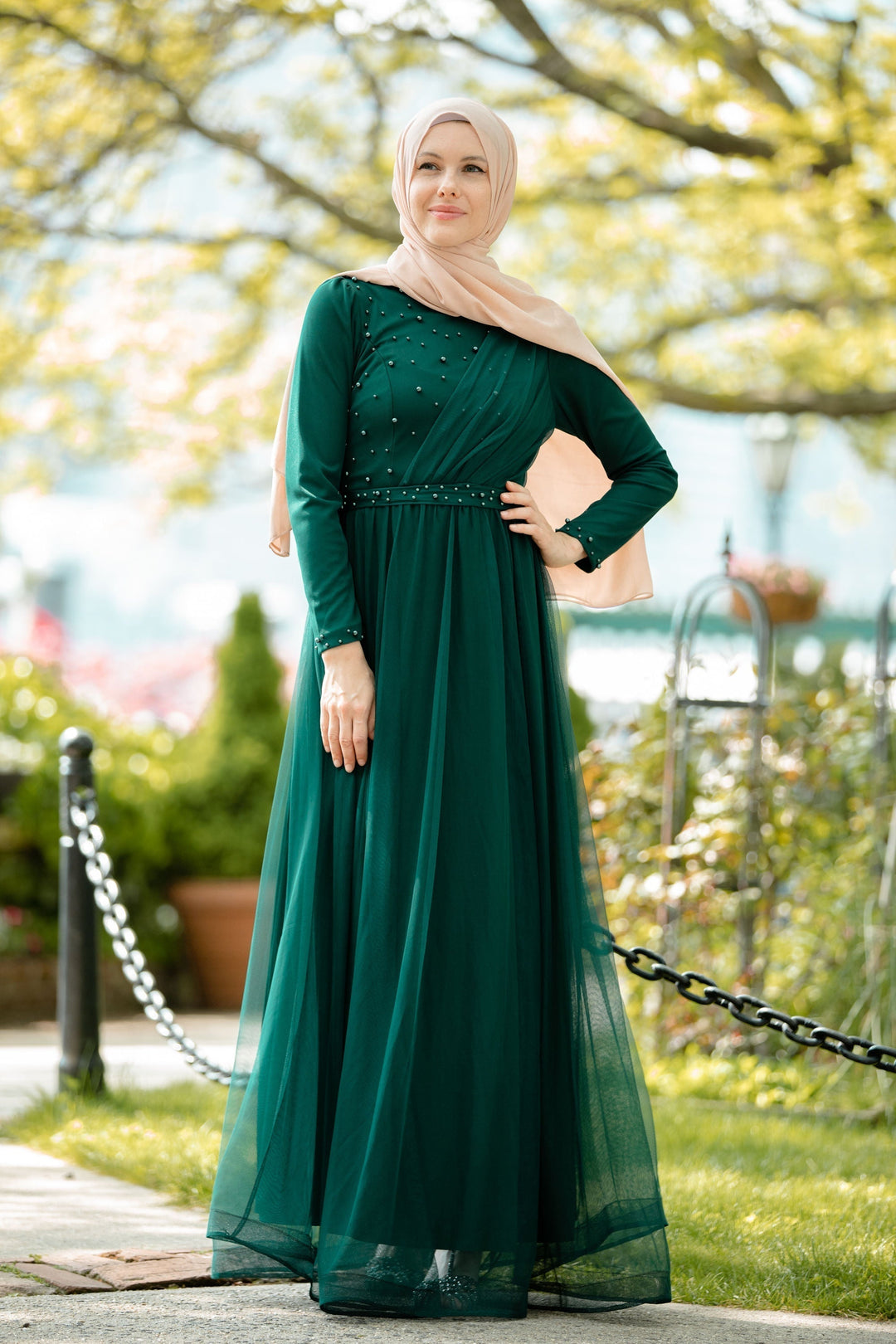 Emerald green modest Side Pearl Gown featuring a flowing maxi dress design