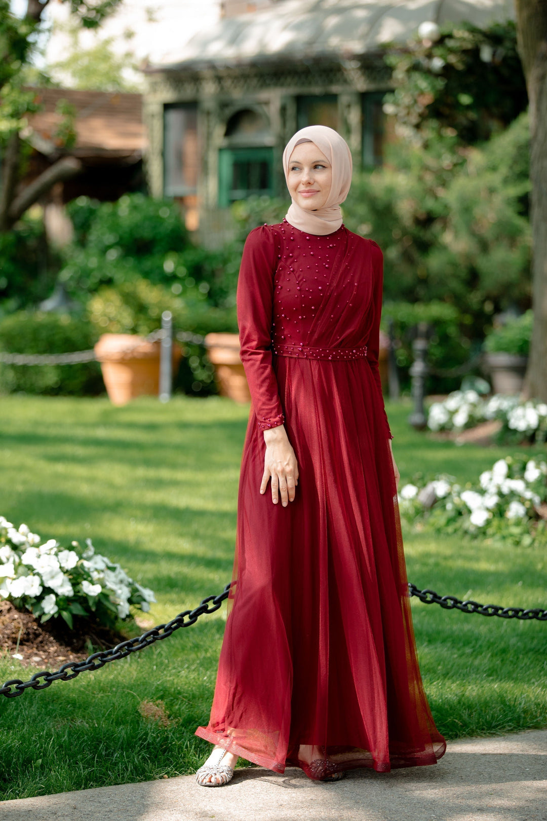 Burgundy long-sleeved maxi dress with hijab featuring elegant pearl gown accents