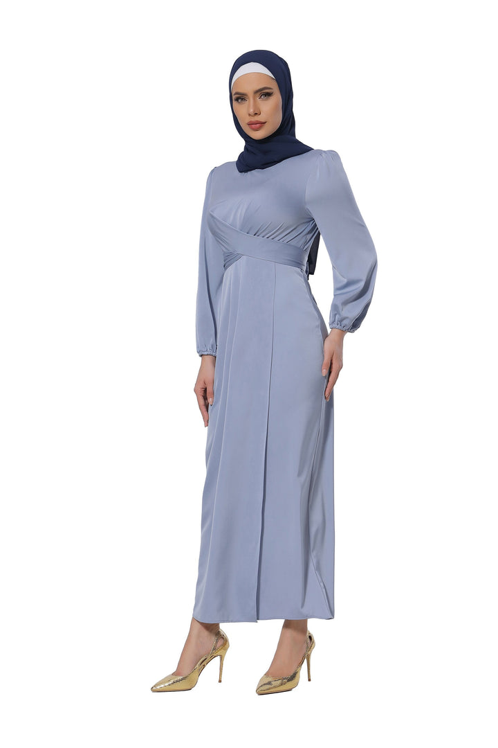 Woman wearing a long-sleeved blue dress and hijab showcasing Silver Criss Cross Satin Faux Wrap Maxi Dress