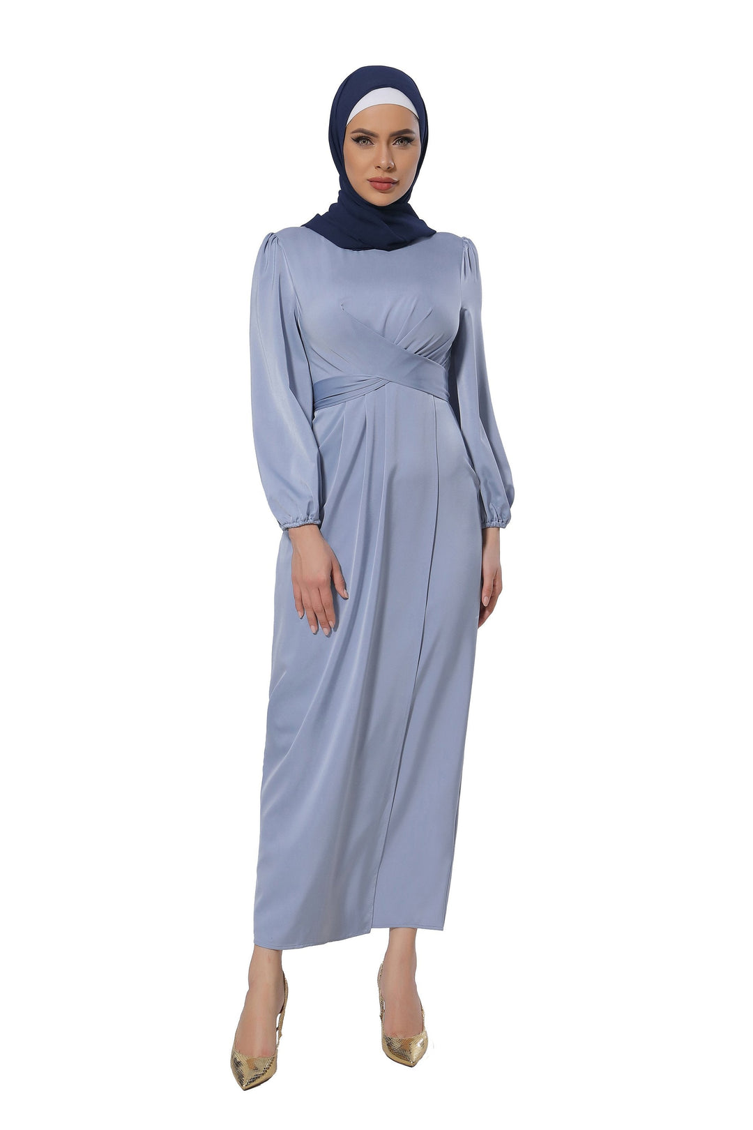 Woman in a blue long-sleeved dress and hijab showcasing the Silver Criss Cross Satin Maxi Dress