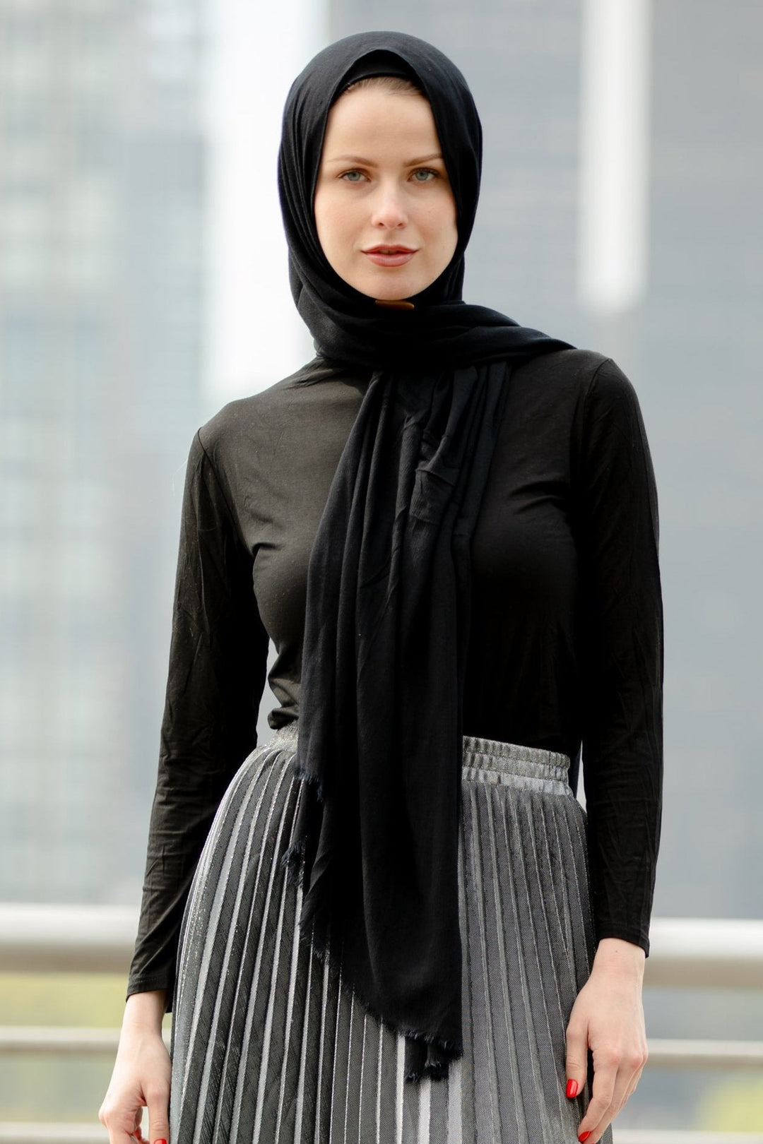 Woman in black hijab showcasing a Silver Metallic Pleated Chiffon Maxi Skirt