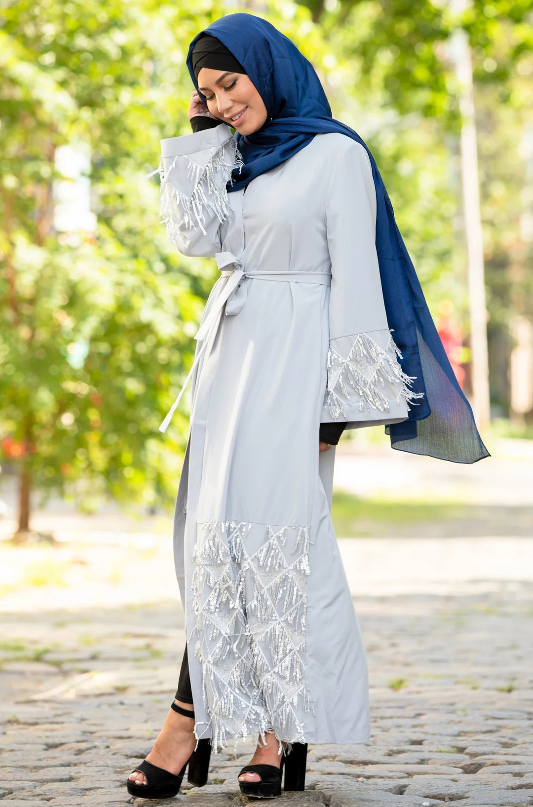 Woman in blue shimmer hijab wearing a Silver Sequin Fringe Open Front Abaya with kimono sleeves