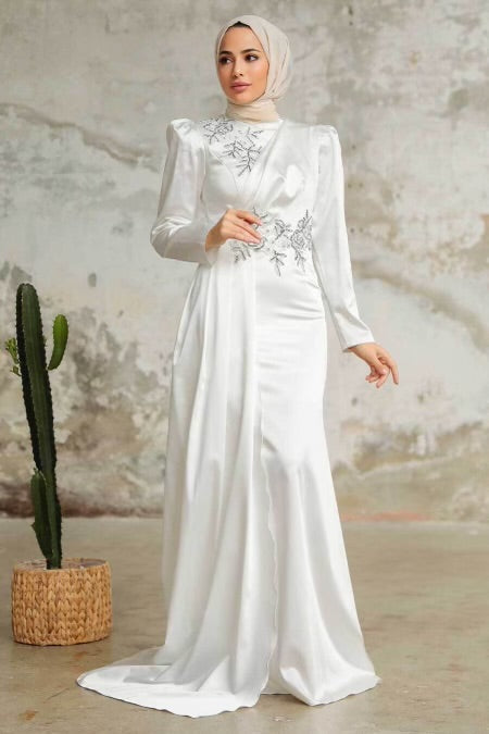 Elegant white satin gown with puff sleeves and side draping for a timeless look