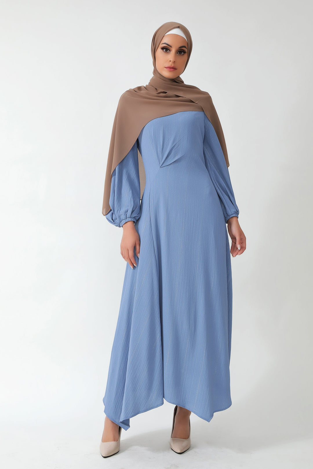 Woman in blue metallic pinstripe dress and brown hijab, showcasing elegance on clearance