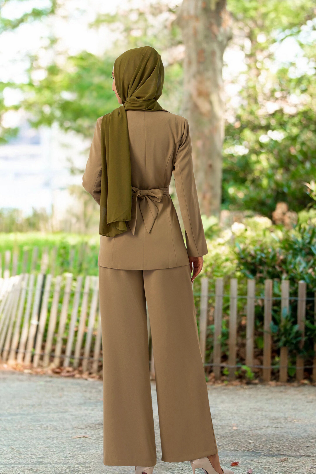 Woman’s taupe jacket and pants suit set with green hijab for modest fashion