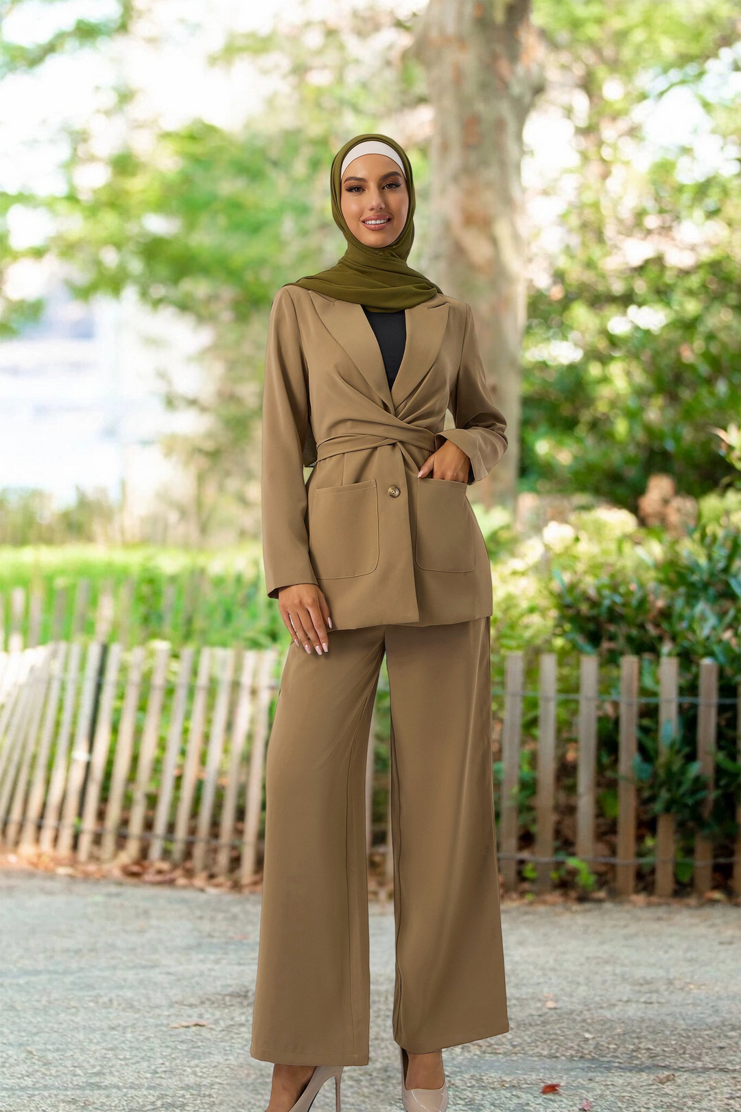 Woman in a tan pantsuit and green hijab showcasing a stylish Taupe Jacket and Pants Suit