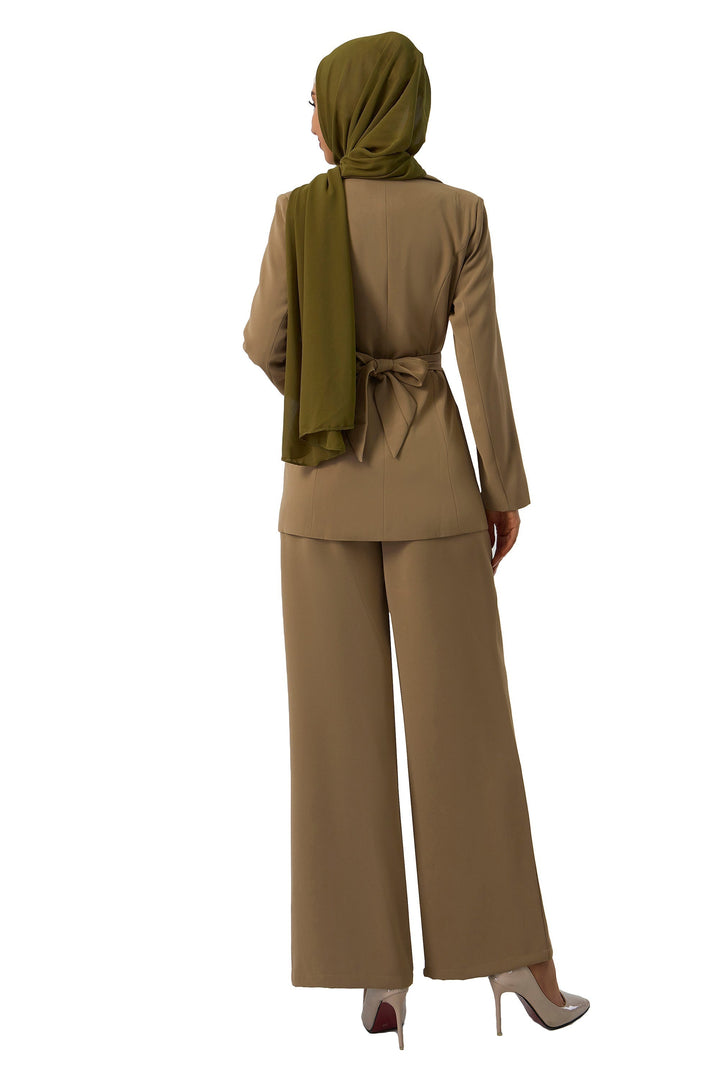 Woman’s taupe jacket and pants suit set styled with a hijab for modest fashion