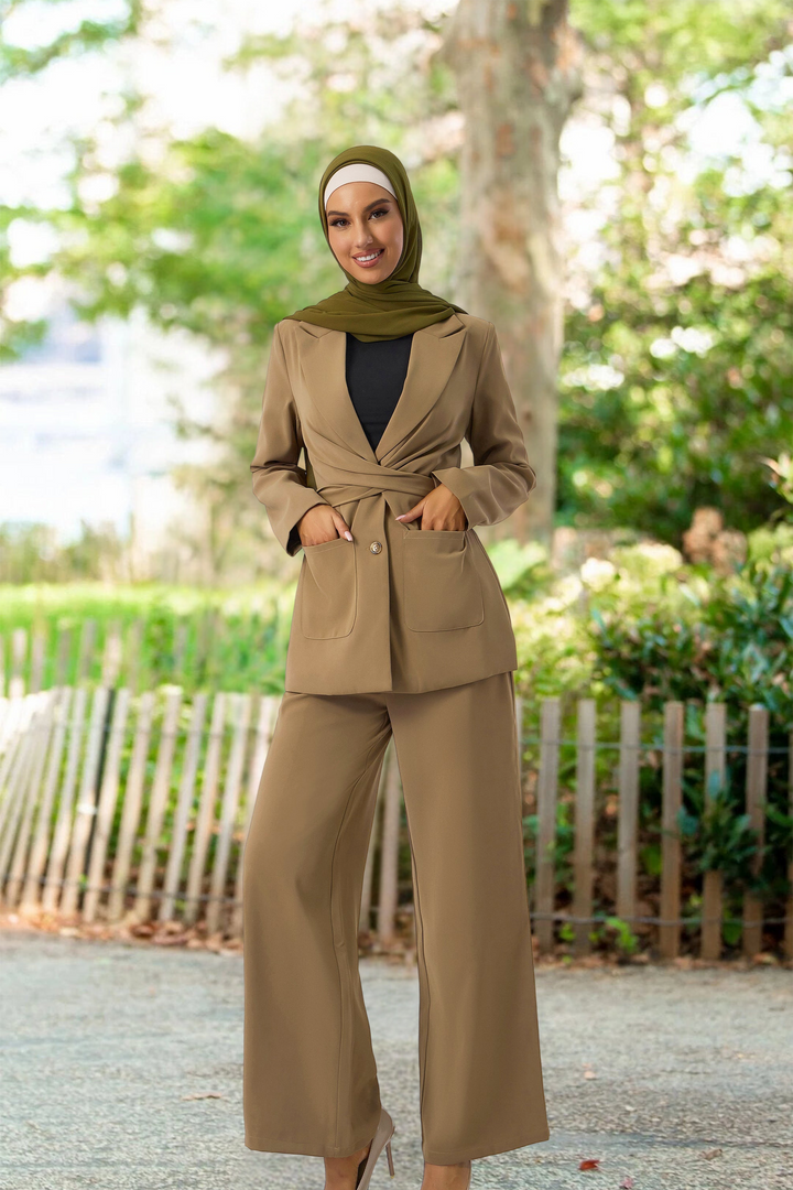 Woman in tan pantsuit with green hijab showcasing the stylish Taupe Jacket and Pants Suit