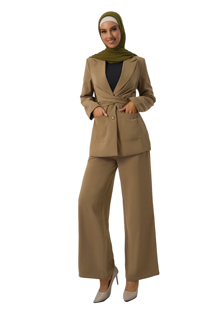 Woman in tan pantsuit and green hijab showcasing the stylish Taupe Jacket and Pants Suit Set